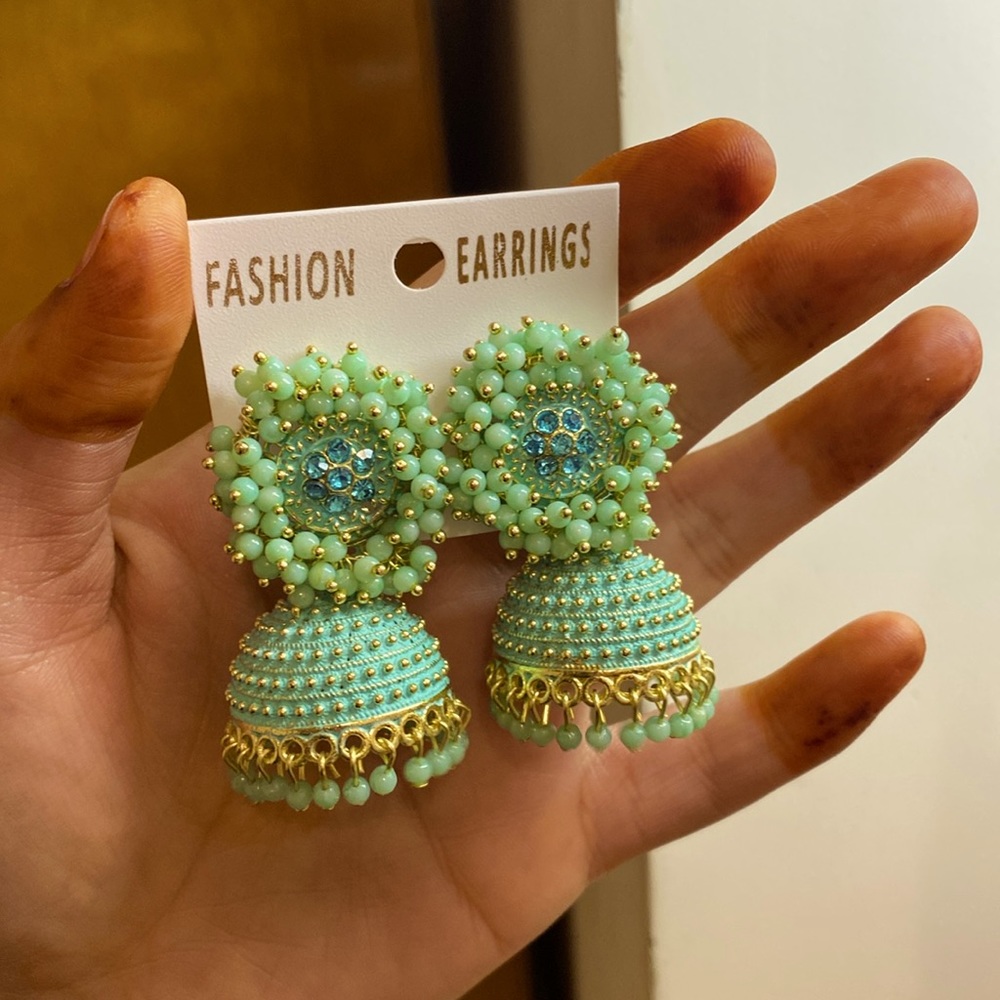 "Elevate your style with these stunning mint color jhumka earrings!